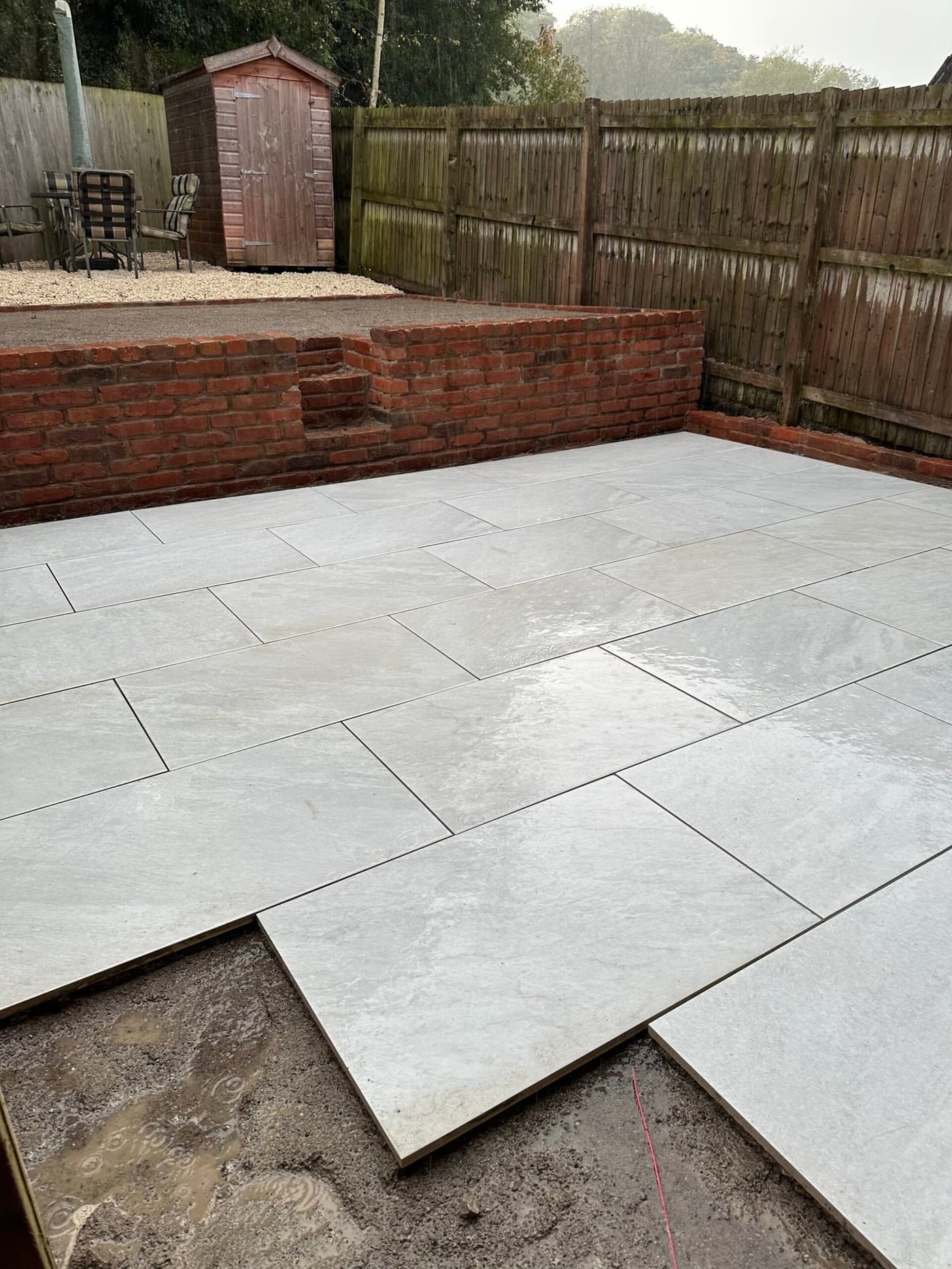 Finished lower terrace with new patio and matching brick retaining wall on the Forge Lane, Congleton garden