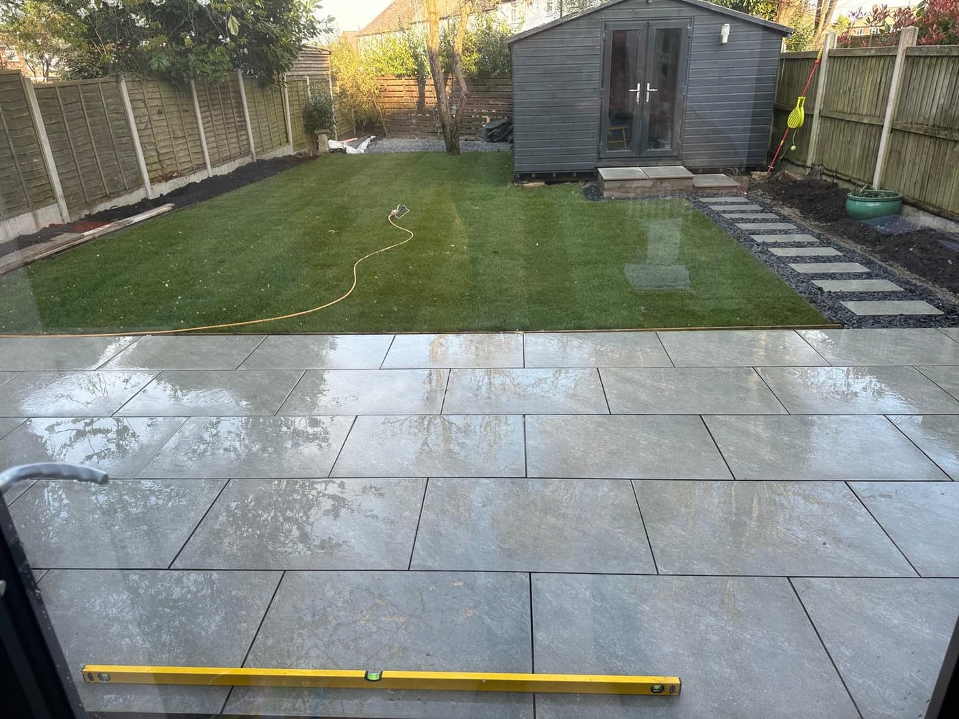 Before and after view of the path to the summer house on the Manor Crescent garden makeover