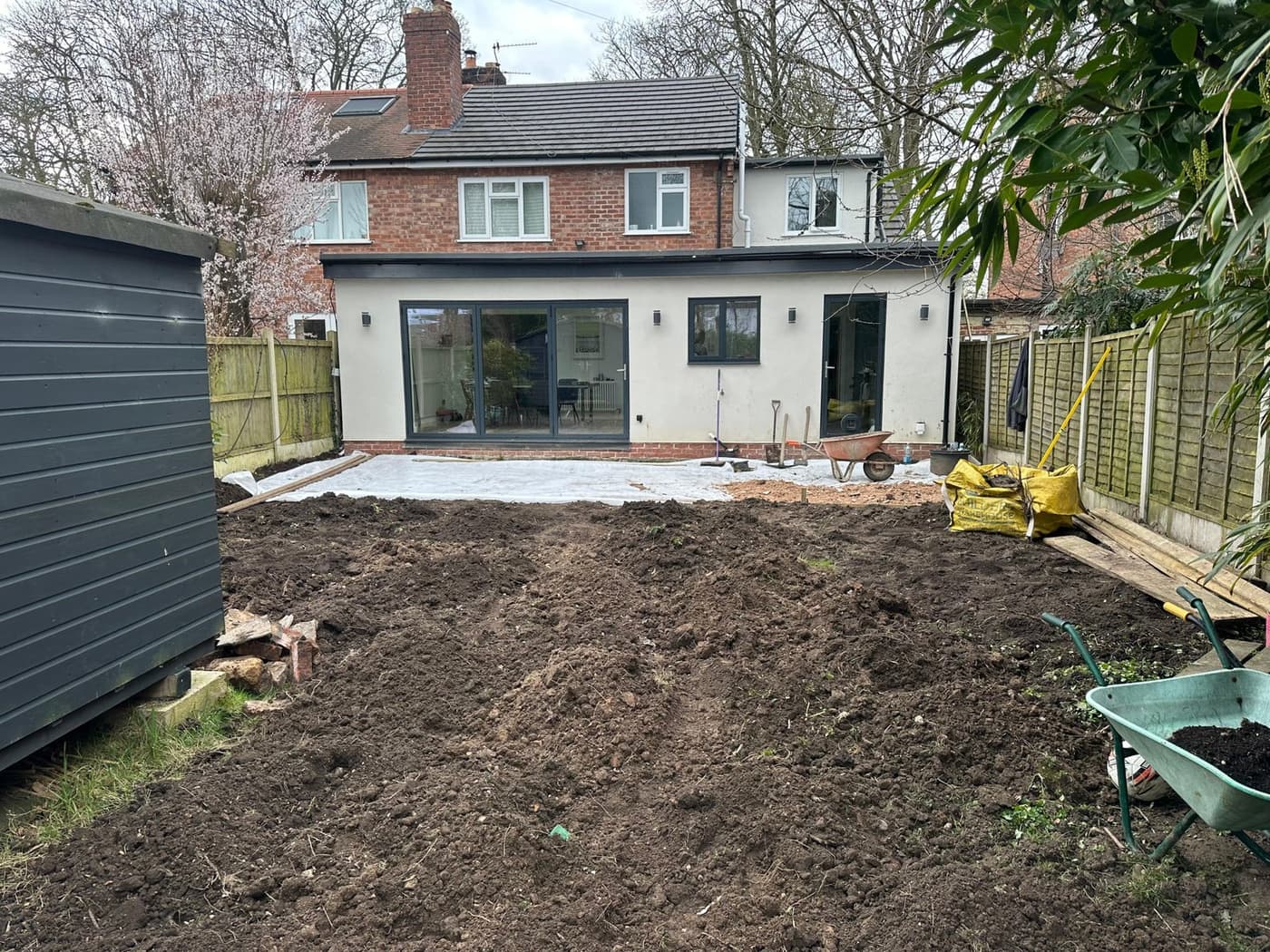 New porcelain patio slabs laid with tight, precise joints during the Manor Crescent garden build