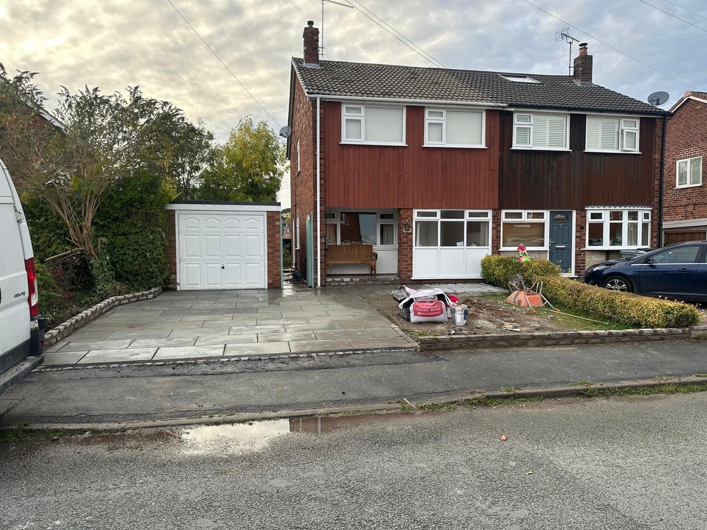 Grey 900 by 600mm Indian stone slabs laid with tight, crisp joints on a Knutsford driveway