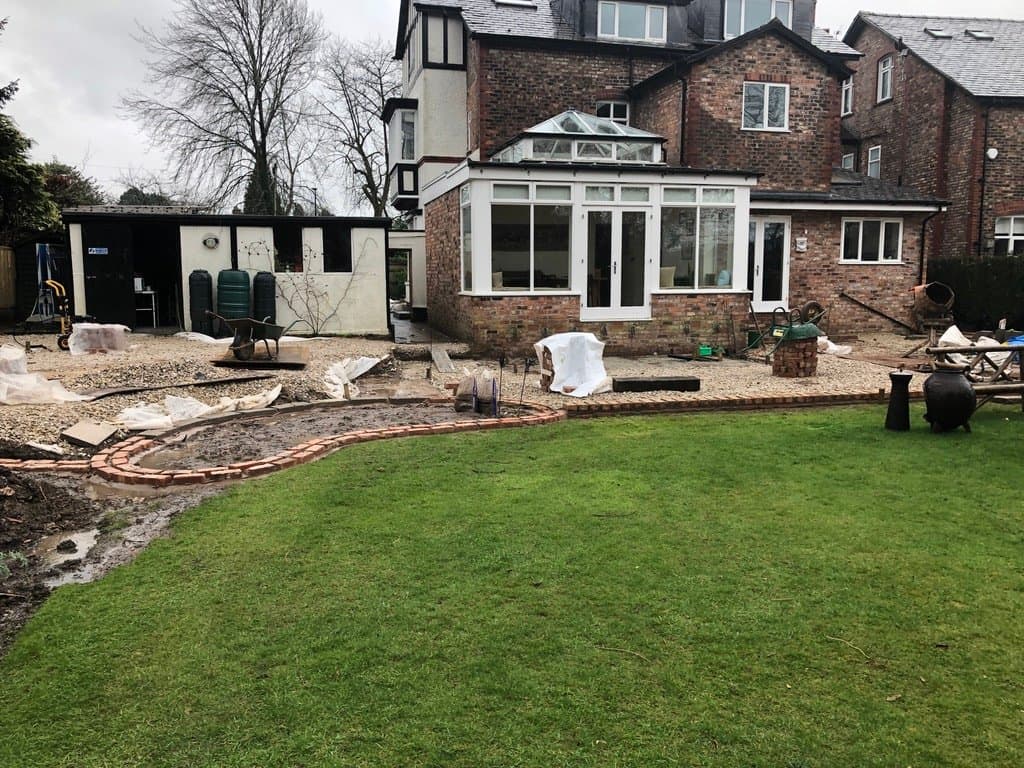 New stone paver patio extending from the conservatory on the Park Road, Hale project