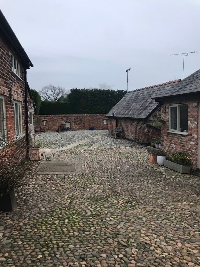 Groundwork and pathway layout during the walled courtyard build at Yew Tree Farm