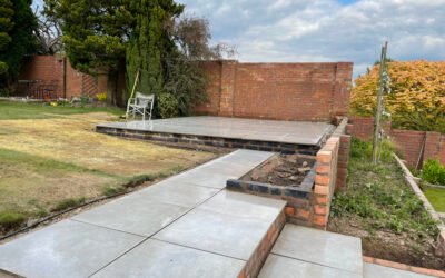 Transforming a Backyard Oasis: Knutsford Road, Wilmslow Landscape Project with Retaining Wall and Porcelain Paving