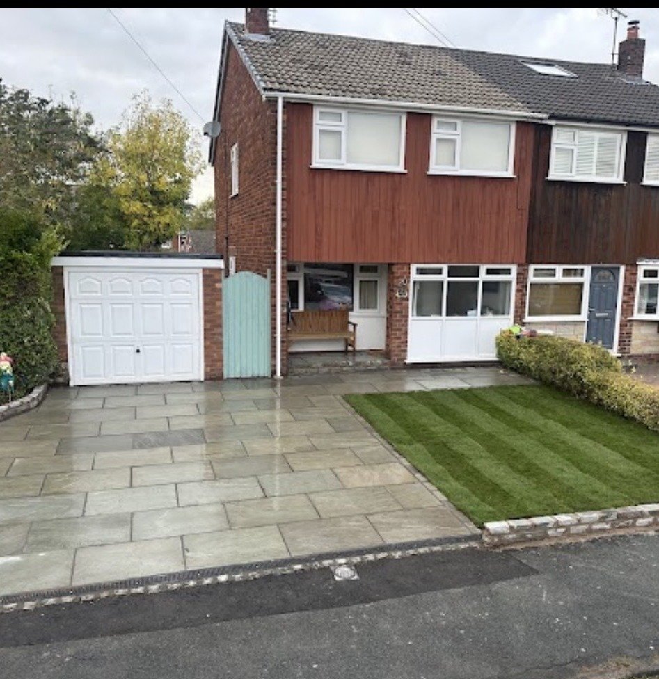 Completed porcelain driveway with striped lawn edging by Cheshire Landscape Gardener